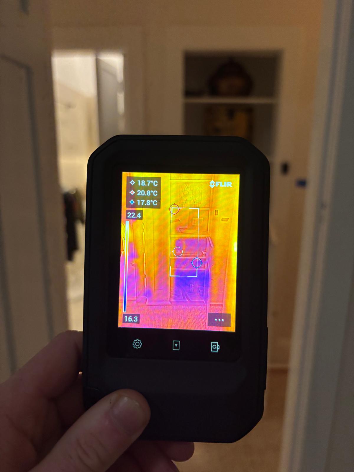 Thermal camera image used to check moisture migration in a hallway and adjoining area